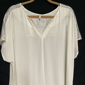 Cato blouse. White with back and white embroidery on the back.
